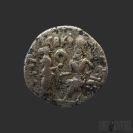 Reverse of ancient Parthian silver drachm showing seated archer Arsakes I on throne holding bow, with Greek inscription, Ekbatana mint, circa AD 147–191.