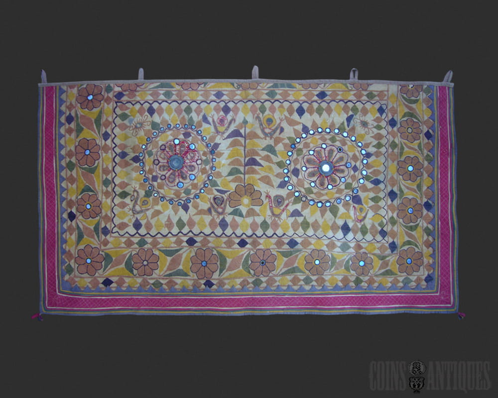 Traditional Indian mirror work tapestry with colorful Gujarati embroidery and handcrafted details.